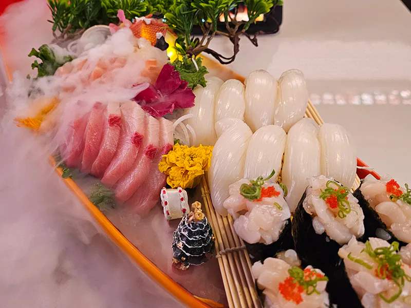 Signature nigiri with yellowtail, squid, and scallops at Pakusan Sushi & Grill, a Japanese Restaurant in Chandler